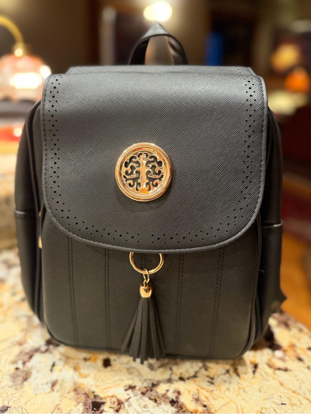 Women's Black Faux Leather Backpack with Gold Medallion Tassel
